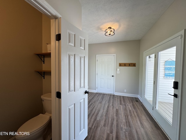 277 Deerfield Way, Lafollette, TN 37766 - foyer entrance featuring dark wood-style floors, a textured ceiling, and baseboards