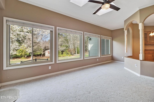 18 Inwood Dr, Fairfield Glade, TN 38558 - carpeted empty room with a healthy amount of sunlight, crown molding, arched walkways, and a ceiling fan