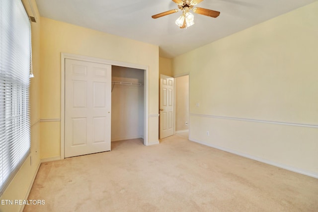 18 Inwood Dr, Fairfield Glade, TN 38558 - unfurnished bedroom with a closet, baseboards, multiple windows, and light colored carpet