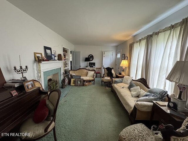 108 W Red Bud Rd, Knoxville, TN 37920 - living room with a fireplace with raised hearth, a healthy amount of sunlight, and carpet