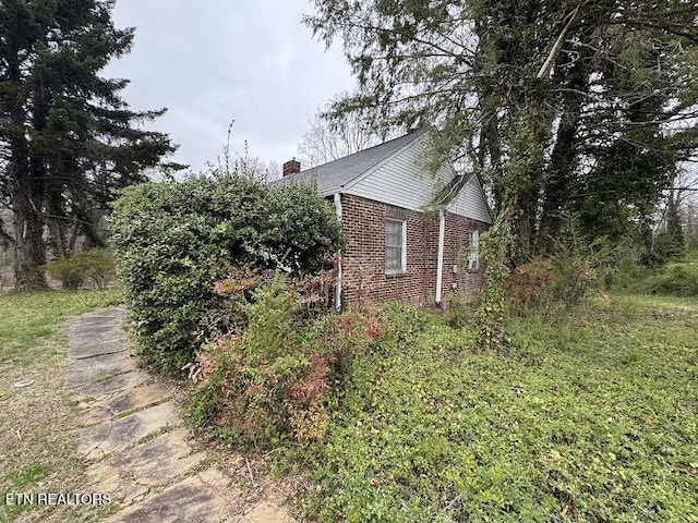 108 W Red Bud Rd, Knoxville, TN 37920 - view of property exterior with a chimney and brick siding