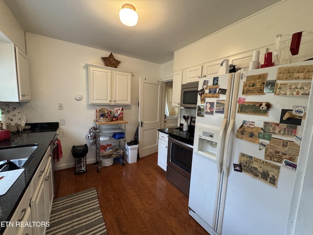 108 W Red Bud Rd, Knoxville, TN 37920 - kitchen featuring dark wood finished floors, white cabinetry, a sink, and appliances with stainless steel finishes