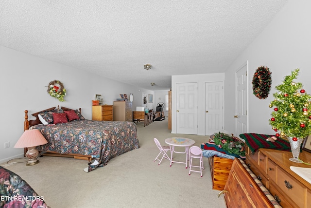 carpeted bedroom with a textured ceiling