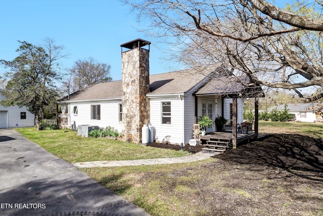 1533 Middlesettlements Rd, Maryville, TN 37801 - view of front of house featuring a chimney, a shingled roof, a front yard, and covered porch