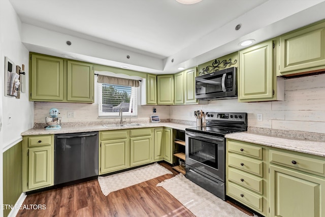 1533 Middlesettlements Rd, Maryville, TN 37801 - kitchen with stainless steel appliances, tasteful backsplash, a sink, and dark wood finished floors