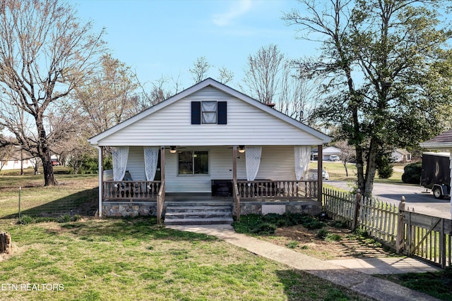 1533 Middlesettlements Rd, Maryville, TN 37801 - bungalow-style house with fence, covered porch, a front yard, and a ceiling fan