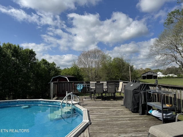 1533 Middlesettlements Rd, Maryville, TN 37801 - pool featuring a wooden deck, outdoor dining area, and area for grilling