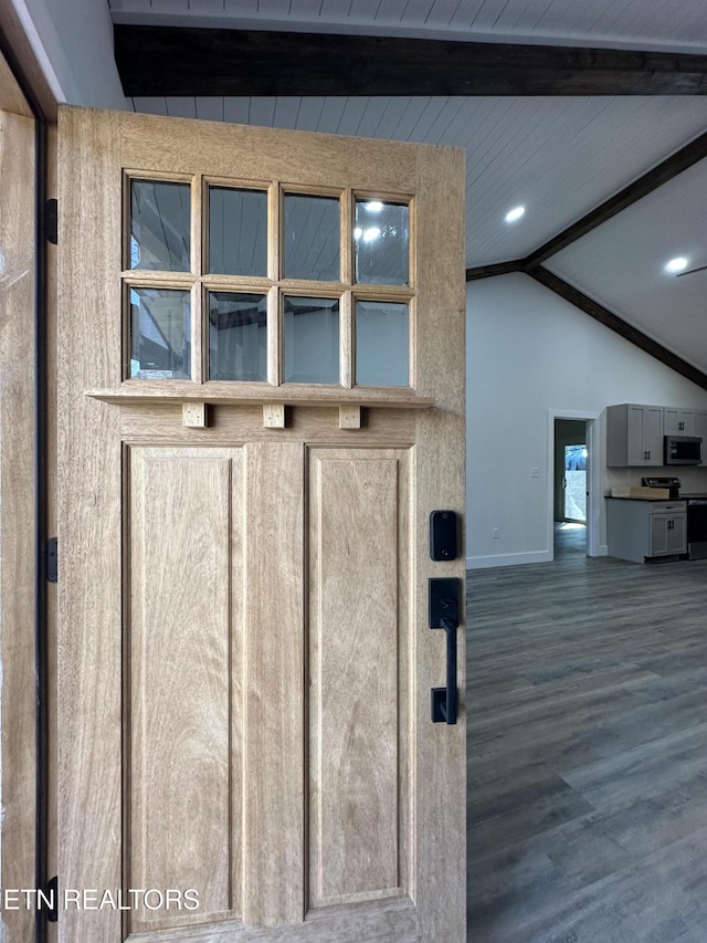 room details with baseboards, stainless steel microwave, recessed lighting, wood finished floors, and electric range