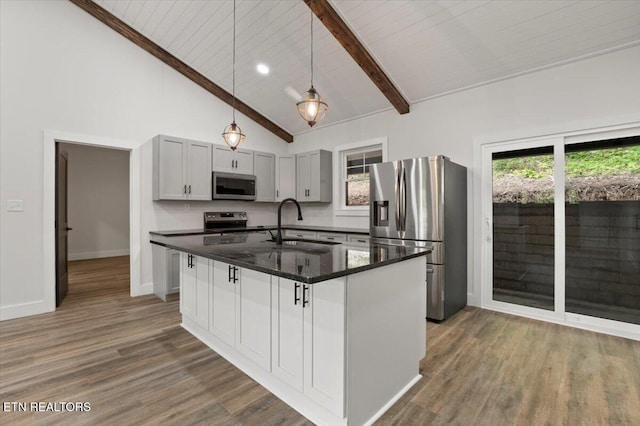 520 Ridge Rd, Caryville, TN 37714 - kitchen with stainless steel appliances, a sink, beam ceiling, high vaulted ceiling, and wood finished floors
