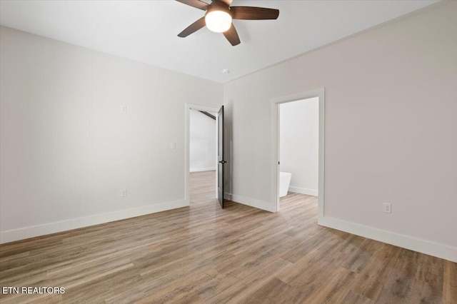 520 Ridge Rd, Caryville, TN 37714 - unfurnished room with a ceiling fan, wood finished floors, and baseboards