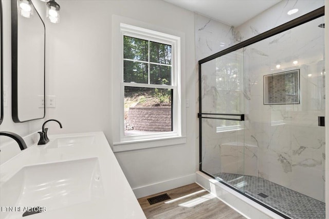 520 Ridge Rd, Caryville, TN 37714 - full bathroom with a marble finish shower, wood finished floors, baseboards, and double vanity