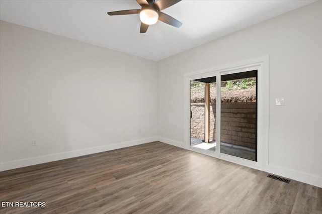 520 Ridge Rd, Caryville, TN 37714 - spare room featuring a ceiling fan, wood finished floors, and baseboards