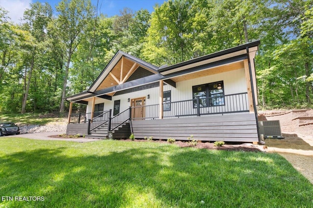 520 Ridge Rd, Caryville, TN 37714 - view of front of house with a porch, central AC, and a front lawn