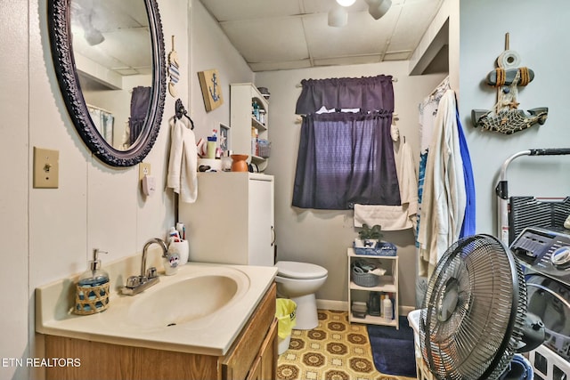 bathroom featuring toilet and vanity