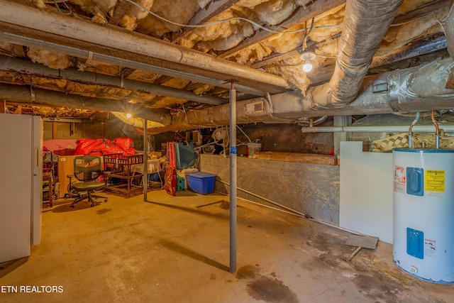275 White Oak Rd, Oakdale, TN 37829 - unfinished basement featuring water heater, visible vents, and freestanding refrigerator