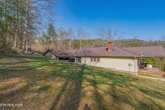 275 White Oak Rd, Oakdale, TN 37829 - view of home's exterior featuring metal roof, a yard, and a chimney