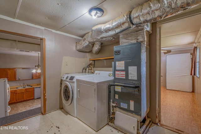 275 White Oak Rd, Oakdale, TN 37829 - laundry area with heating unit, a sink, separate washer and dryer, laundry area, and visible vents
