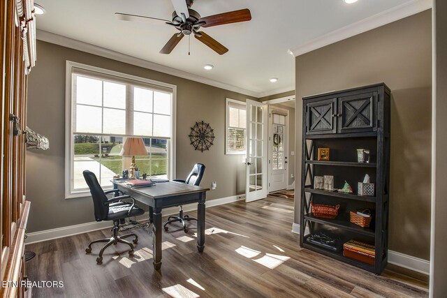 office space with baseboards, ornamental molding, ceiling fan, dark wood-type flooring, and french doors