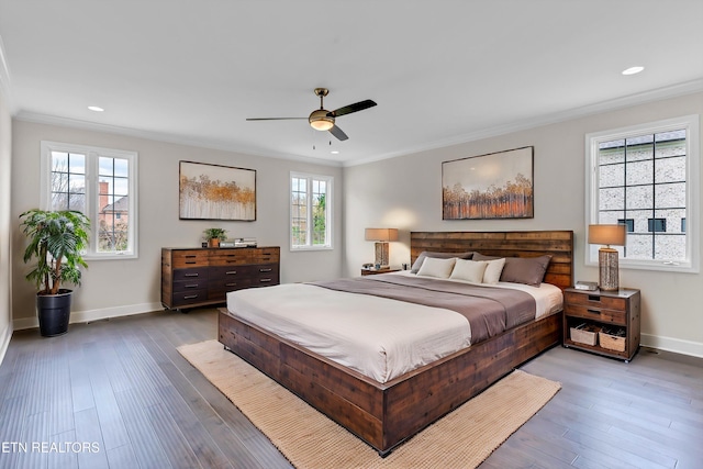 bedroom featuring multiple windows, baseboards, ornamental molding, and recessed lighting