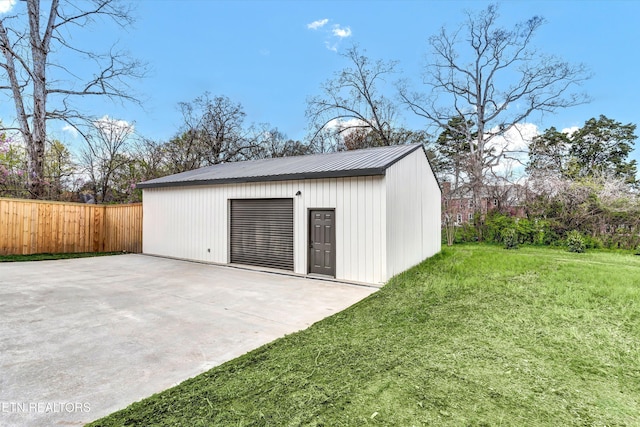 view of outbuilding with an outdoor structure and fence