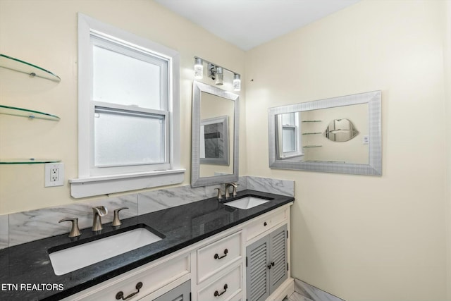 bathroom with double vanity and a sink