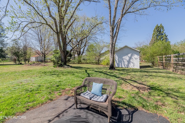 733 Waco Rd, Knoxville, TN 37919 - view of yard featuring a shed, an outbuilding, and fence