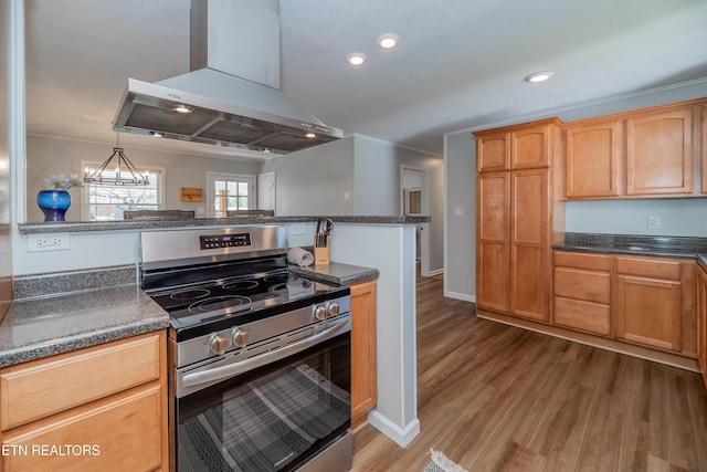 733 Waco Rd, Knoxville, TN 37919 - kitchen featuring wall chimney range hood, wood finished floors, dark countertops, and stainless steel electric stove