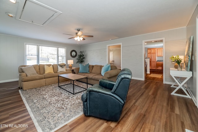733 Waco Rd, Knoxville, TN 37919 - living area with attic access, crown molding, ceiling fan, and dark wood finished floors