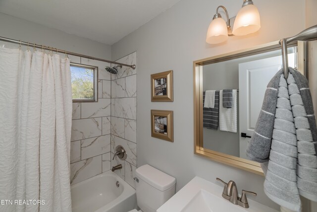 733 Waco Rd, Knoxville, TN 37919 - bathroom with toilet, a sink, and shower / bath combo