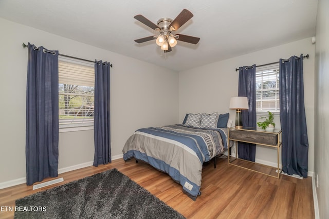 733 Waco Rd, Knoxville, TN 37919 - bedroom featuring multiple windows, visible vents, and wood finished floors