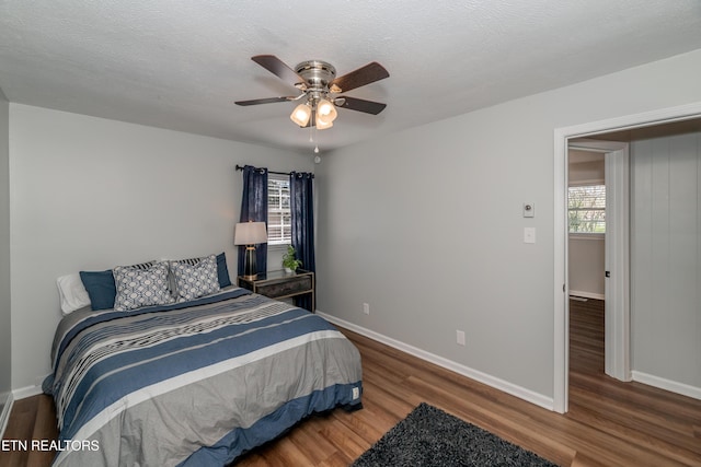733 Waco Rd, Knoxville, TN 37919 - bedroom with a ceiling fan, a textured ceiling, baseboards, and wood finished floors