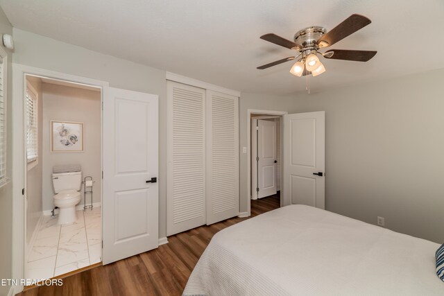 733 Waco Rd, Knoxville, TN 37919 - bedroom featuring a closet, a ceiling fan, ensuite bath, marble finish floor, and baseboards