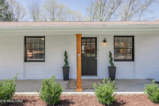 733 Waco Rd, Knoxville, TN 37919 - entrance to property featuring covered porch and brick siding