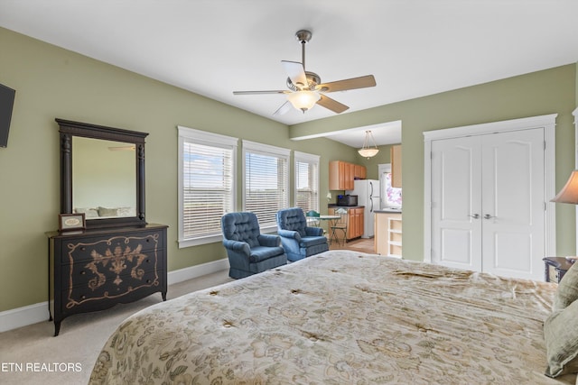 134 At Crumley Rd, Rockford, TN 37853 - bedroom featuring light colored carpet, baseboards, ceiling fan, freestanding refrigerator, and a closet