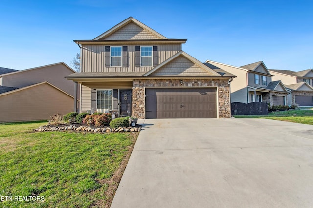 craftsman inspired home with concrete driveway, stone siding, board and batten siding, a front lawn, and a garage