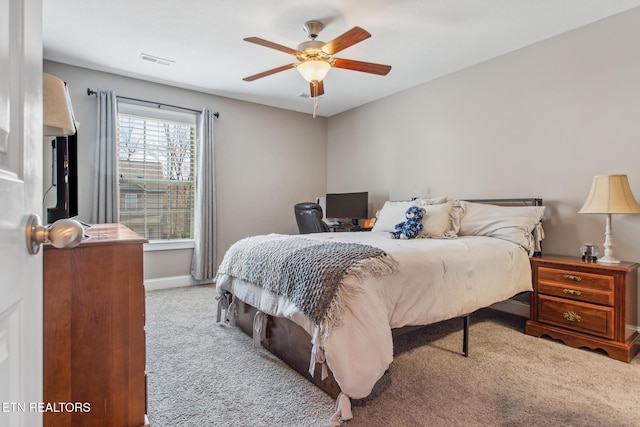 bedroom featuring baseboards, carpet floors, ceiling fan, and visible vents