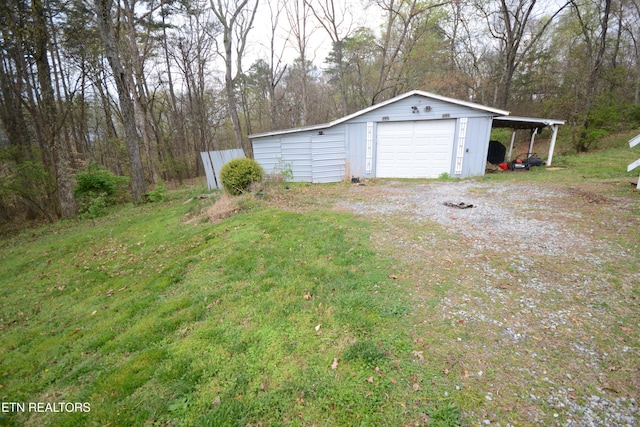 519 Temple Rd, Seymour, TN 37865 - view of yard featuring an outdoor structure, driveway, and a detached garage