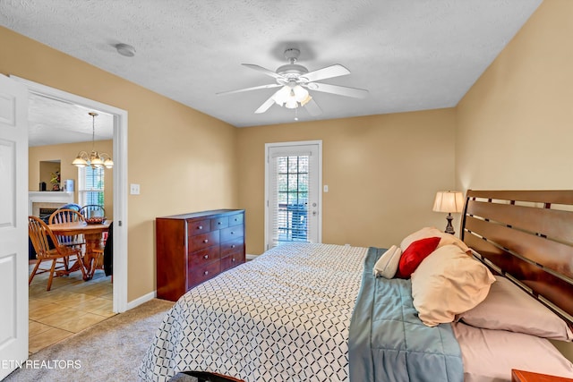bedroom with access to outside, ceiling fan with notable chandelier, a textured ceiling, light colored carpet, and baseboards