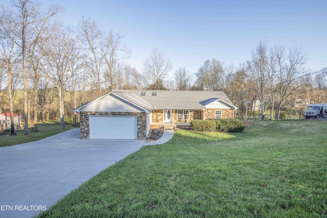 ranch-style home with an attached garage, stone siding, driveway, a front lawn, and covered porch