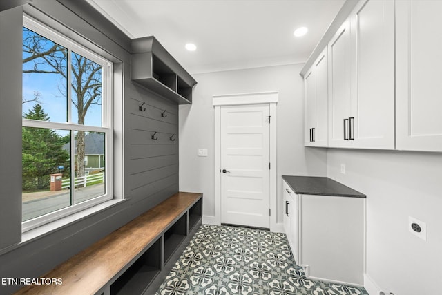 mudroom with recessed lighting and baseboards