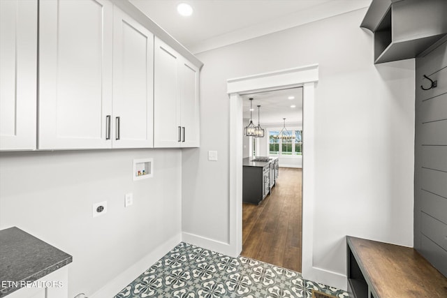 clothes washing area with cabinet space, baseboards, electric dryer hookup, and recessed lighting