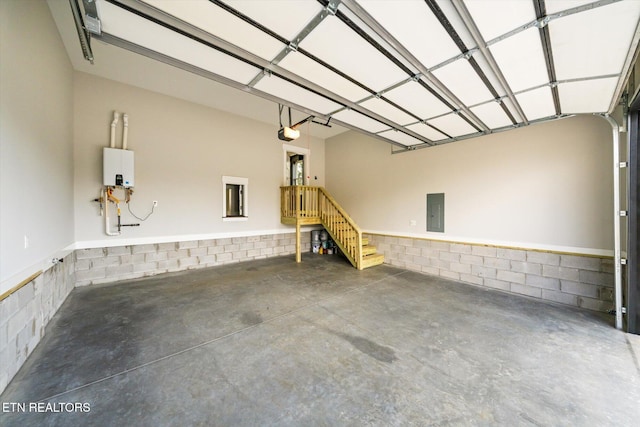 garage featuring a garage door opener and electric panel