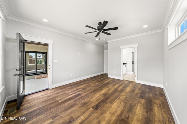 unfurnished bedroom with multiple windows, baseboards, and wood finished floors