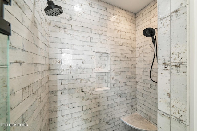 full bathroom featuring a tile shower