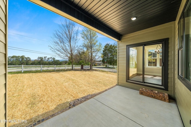 view of yard featuring a patio and fence