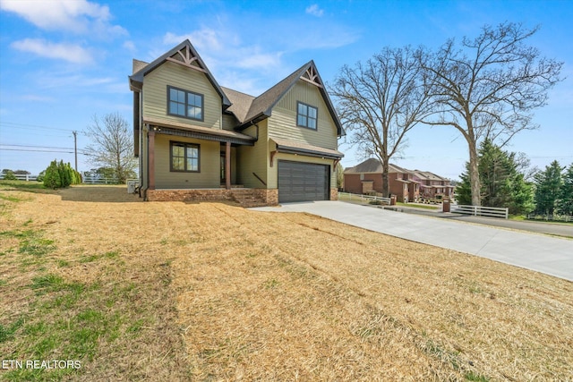 view of front of house with roof with shingles, driveway, a garage, and a front lawn