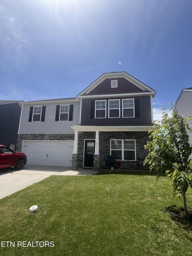 8071 Dennis Fox Ln, Knoxville, TN 37938 - view of front of property featuring driveway, board and batten siding, a front yard, and an attached garage