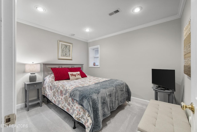 bedroom with crown molding, carpet flooring, and baseboards