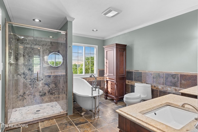 full bathroom featuring a shower stall, crown molding, tile walls, vanity, and a freestanding bath