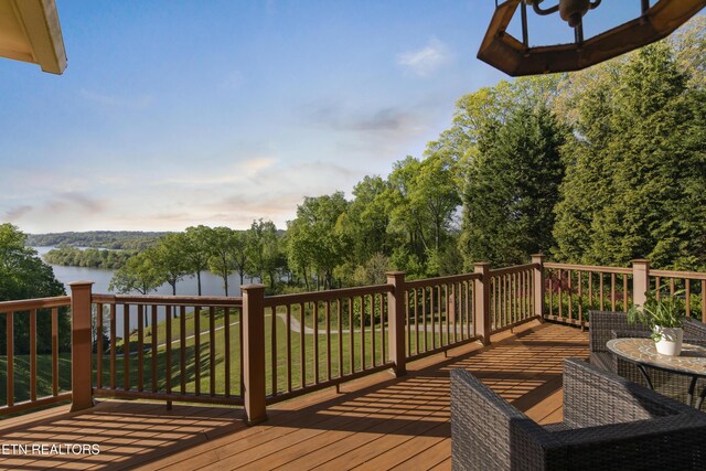 wooden deck featuring a water view